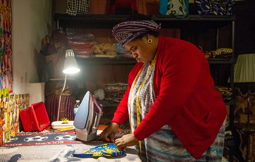 Featured image for Tortured By Rebels in Africa, Refugee Sews Her Way to a New Life in Midwest