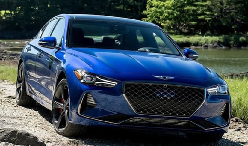 Blue car in a field