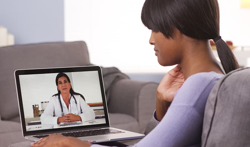 Woman talking to a doctor via computer