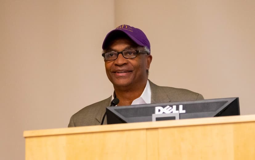 BruceLincoln at a podium