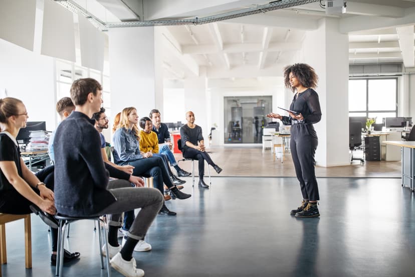 Woman speaking before a crowd