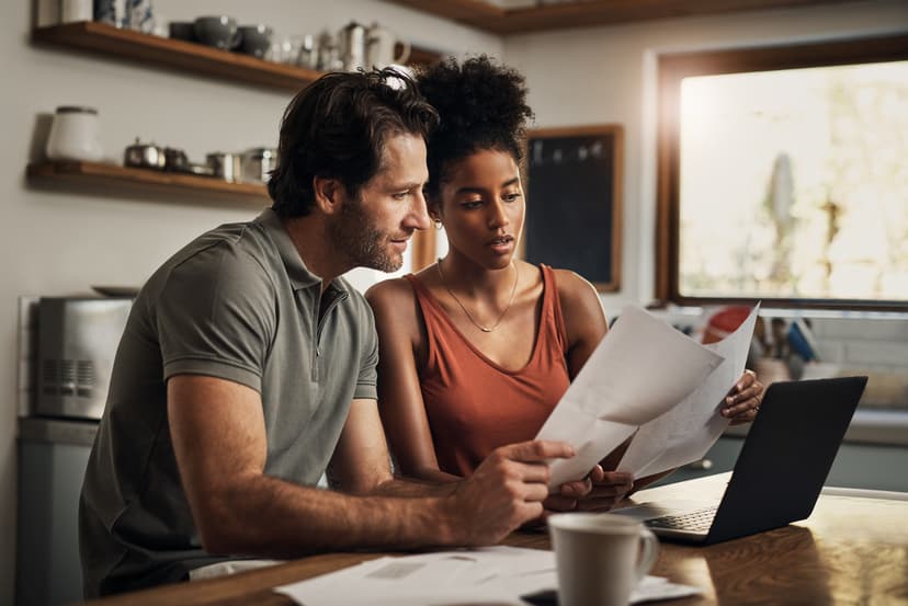 Young couple examining documents