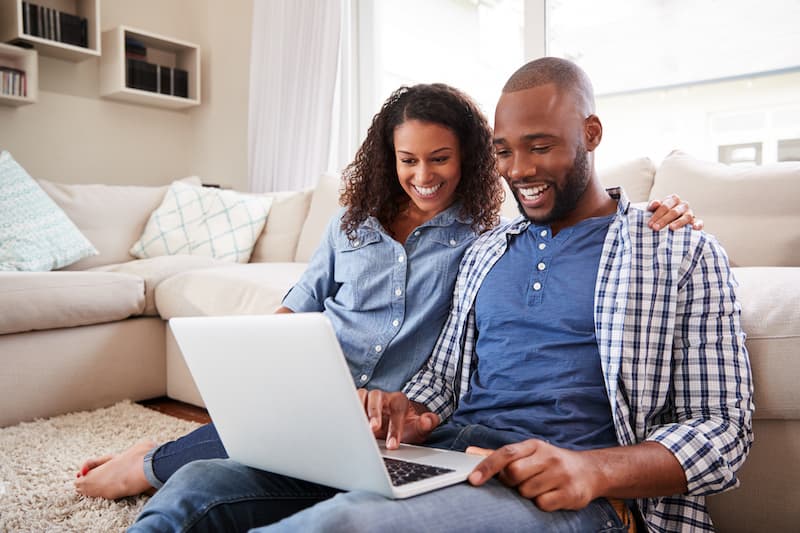 couple looking into a laptop