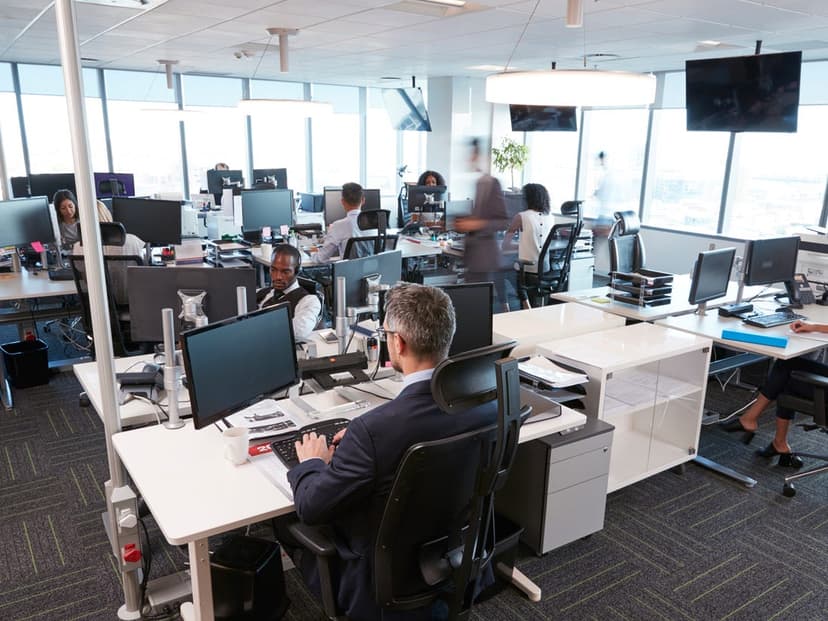 Workplace desks separated for social distancing