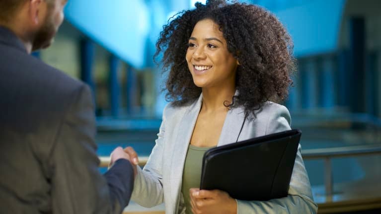 Woman shaking someone's hands