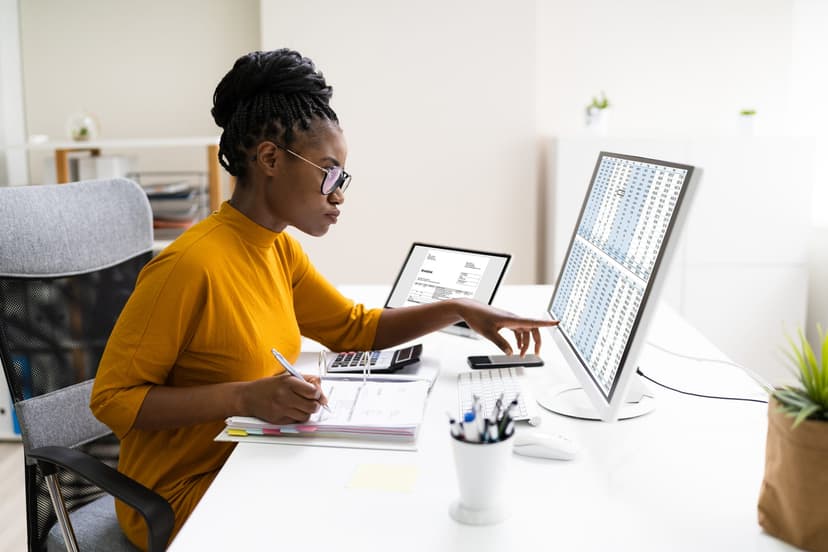 Woman working on desktop computer at a desk