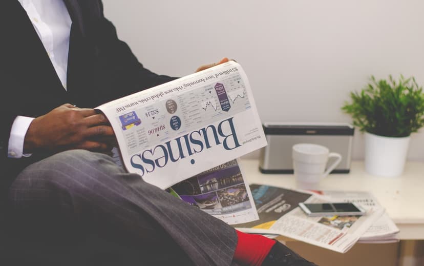 Black man reading newspapeer