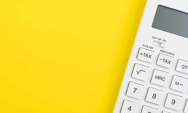 a calculator on a yellow backdrop