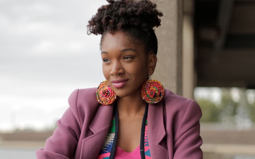 Woman smiling wearing colorful attire