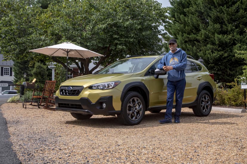 Man standing in front of an SUV