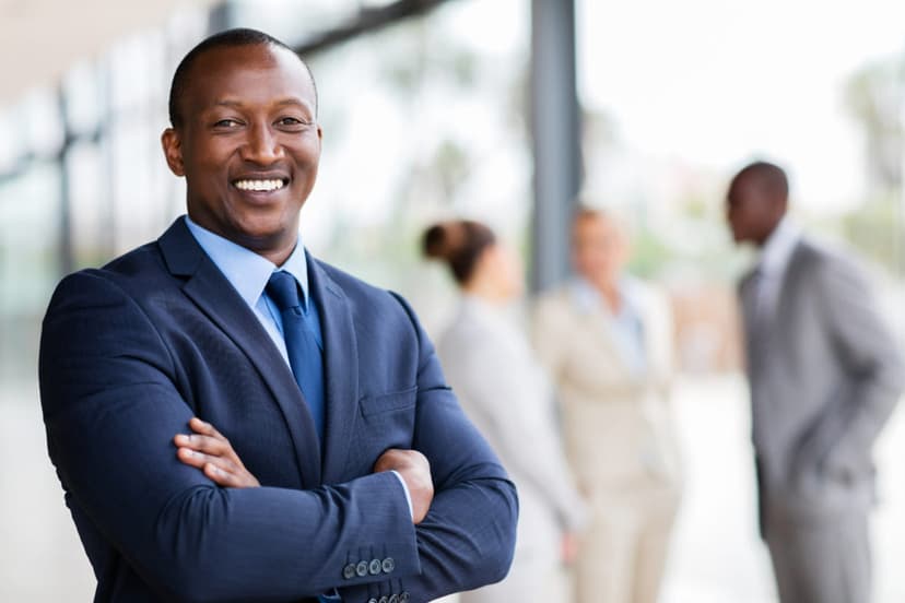 Black professional man in a suit smiling