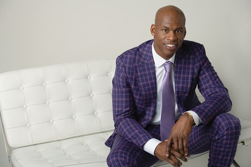 Man sitting on a cream leather couch