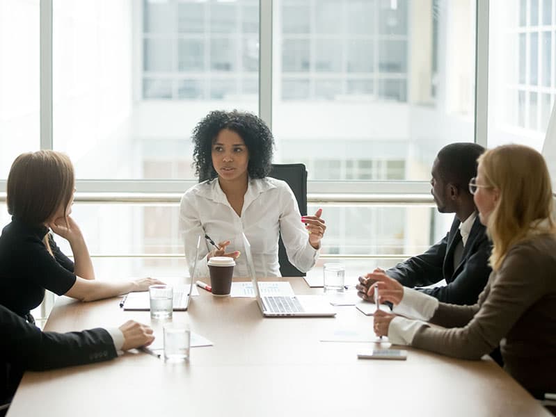 Black woman leading a meeting