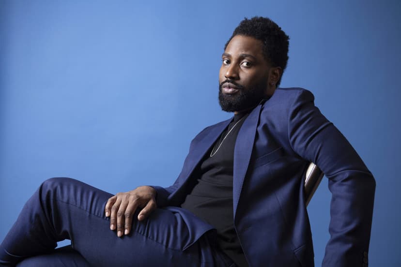 Man seated in blue suit