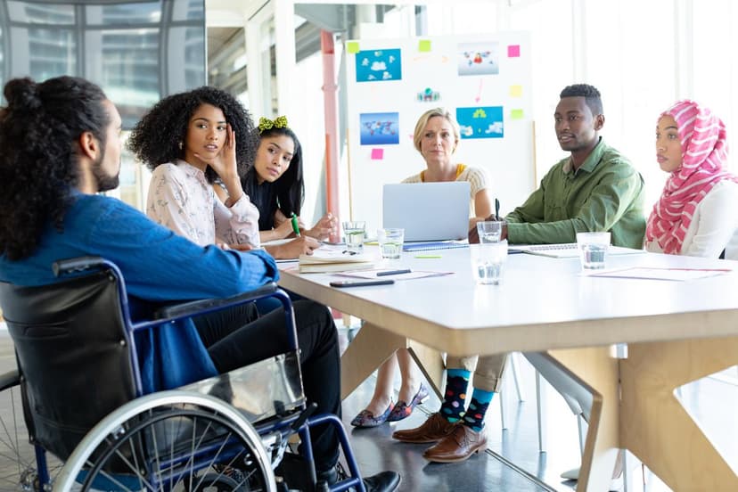 diverse colleagues seated around a table