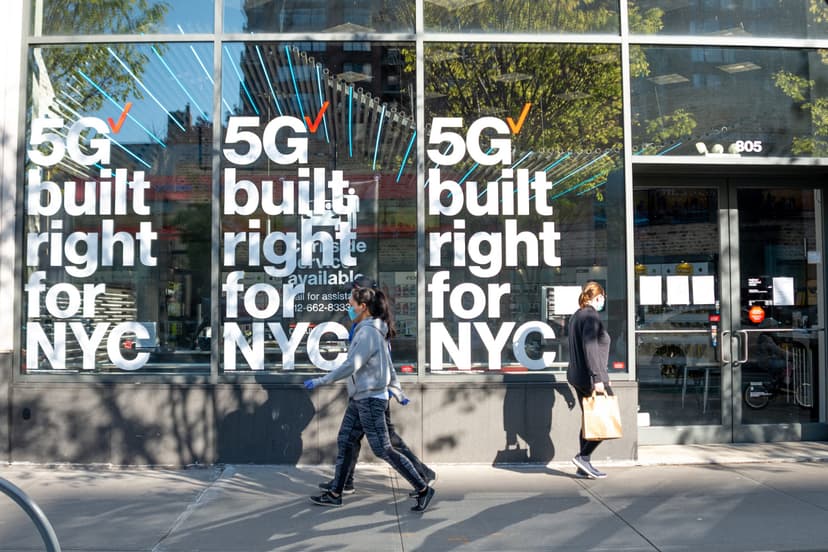 5g signage behind woman walking