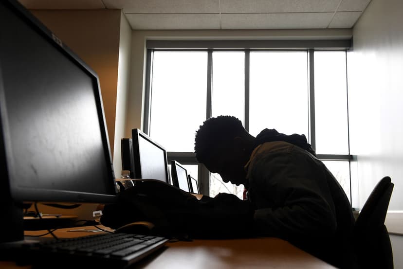 Man with head down on a desk