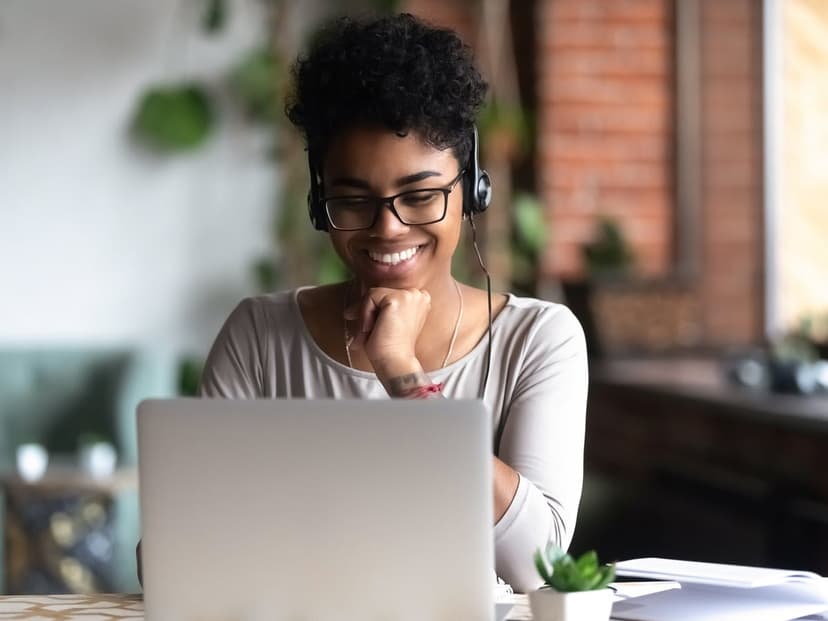 girl seated at a laptop