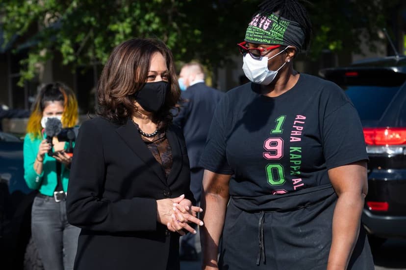 Kamala Harris speaking with a voter