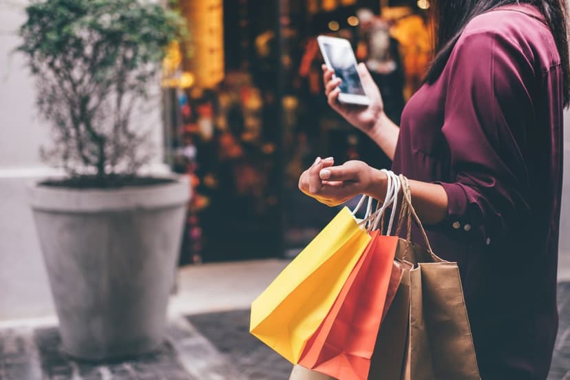 woman holding shopping bags