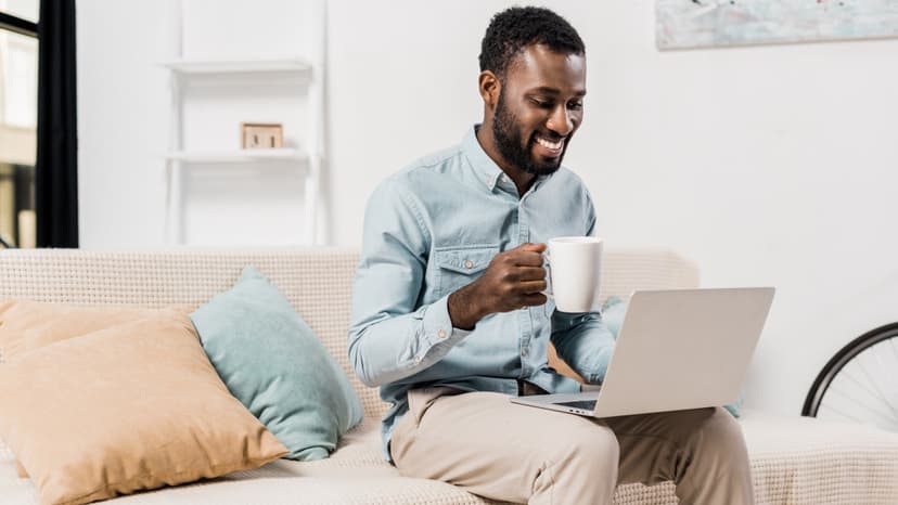 Man seated at desk with laptop