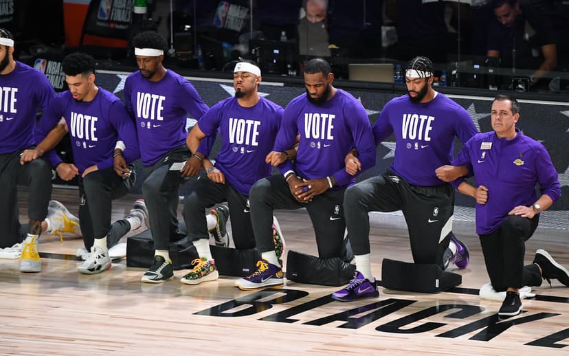 LeBron James and other players on the Los Angeles Lakers dressed in purple vote t-shirts