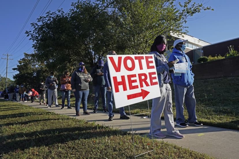 people line up near red & white signage