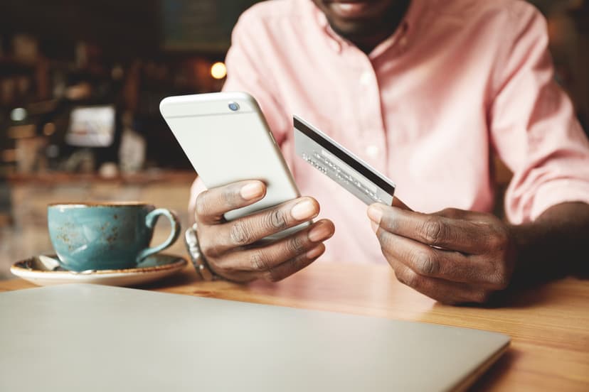 guy seated with a credit card