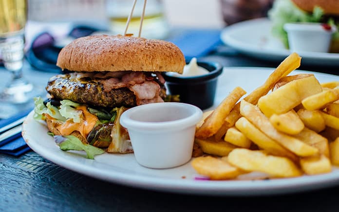 Featured image for “White Burgers, Black Cash:” How Fast Food Went from Excluding to Exploiting Blacks