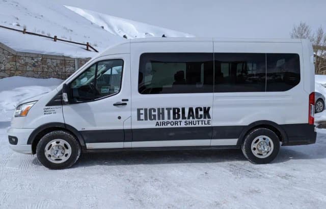 Eight Black Airport Shuttle