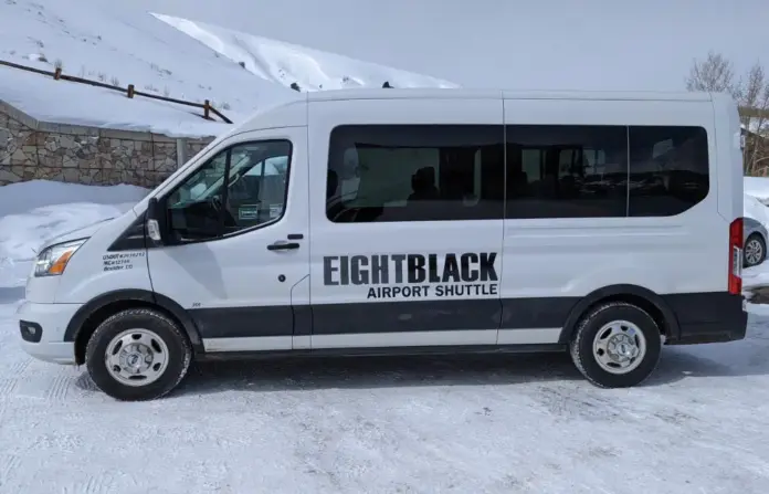 Eight Black Airport Shuttle